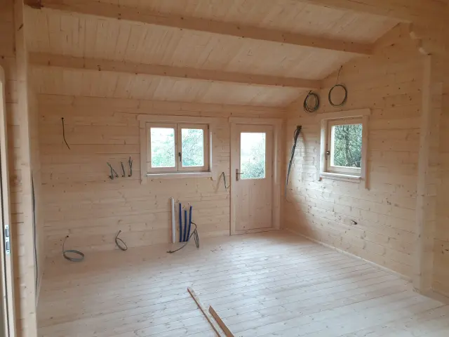 Timber cabin in an Irish garden fitted out with a shower room and kitchenette