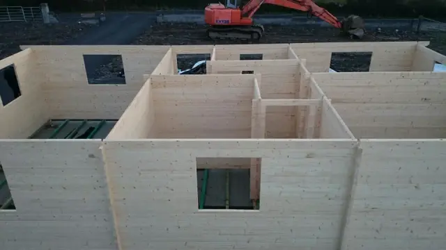 Timber cabin standing on a prepared level base